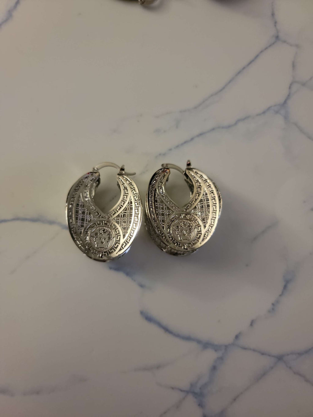 V lady hoop earring image 0