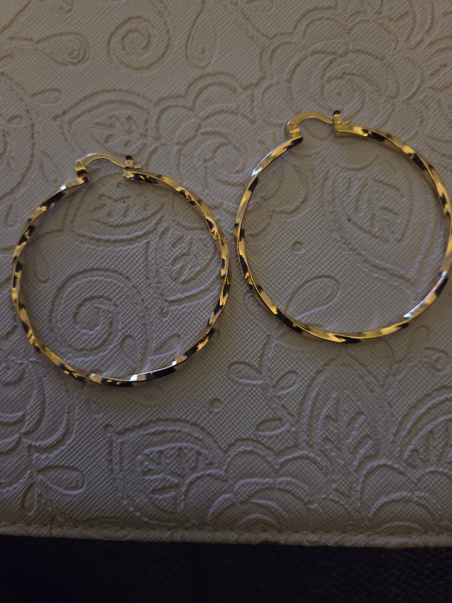 Gold twirl hoops
