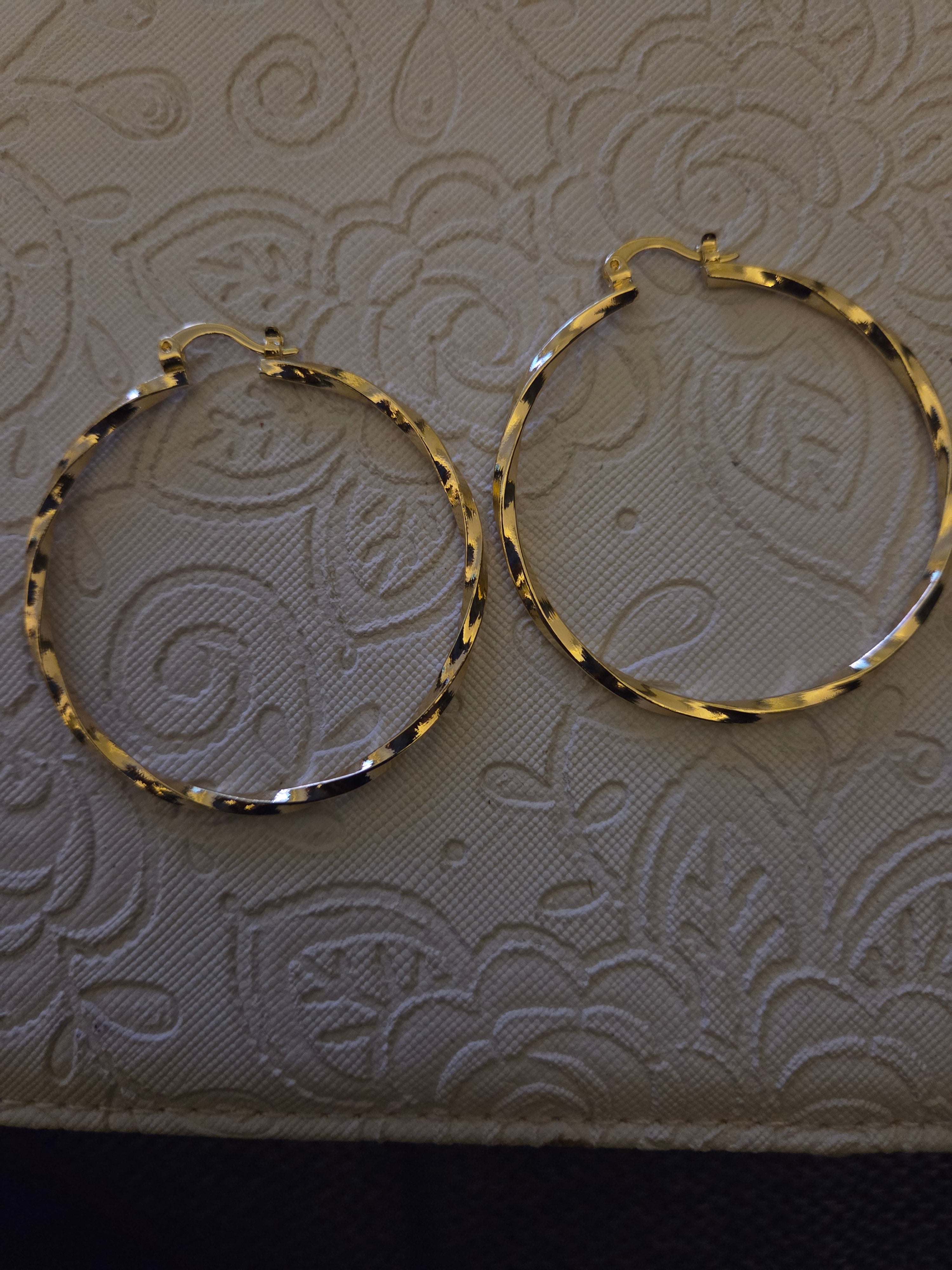 Gold twirl hoops