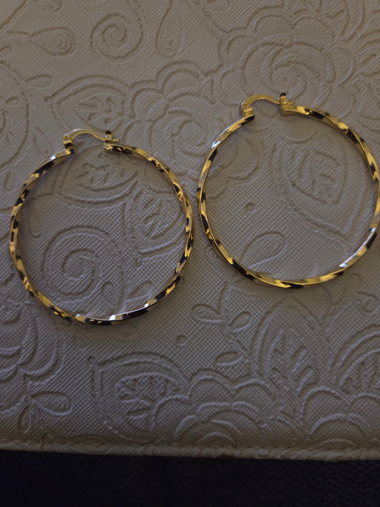 Gold twirl hoops
